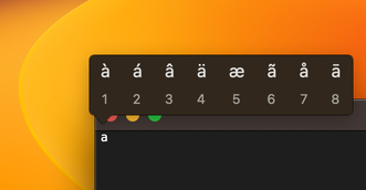 A screenshot of the accents menu over TextEdit, obtained by holding down the 'a' key.